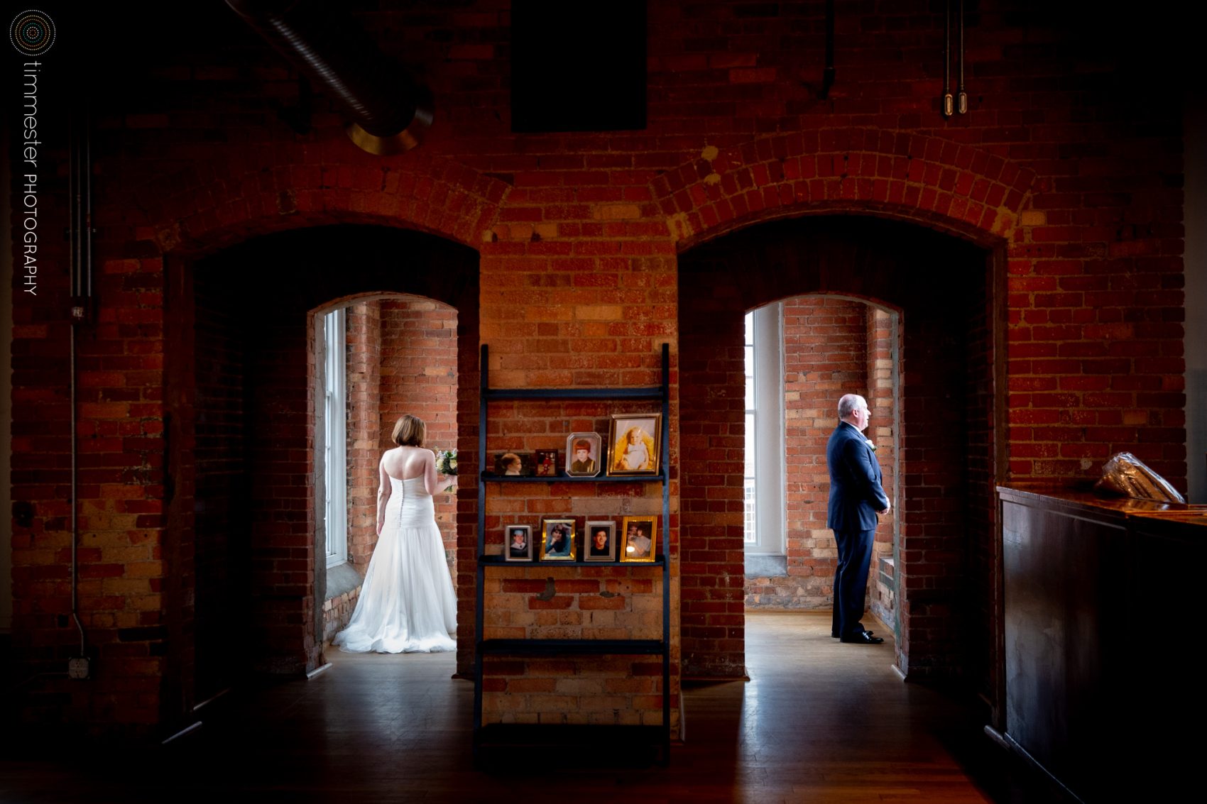 The First Look between Jessica + David at their The Cotton Room wedding in North Carolina.