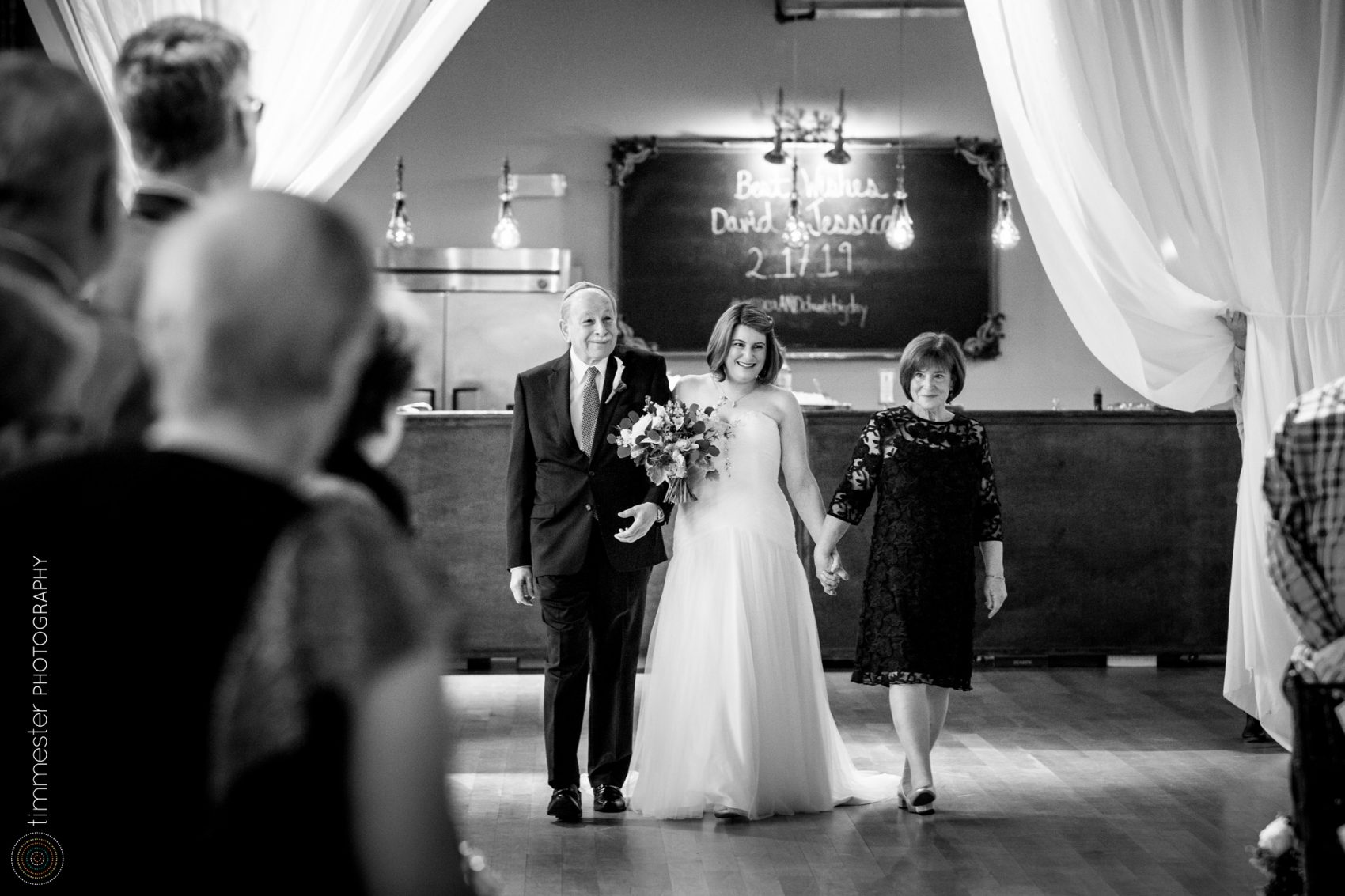 The wedding ceremony of Jessica + David at The Cotton Room in Durham.