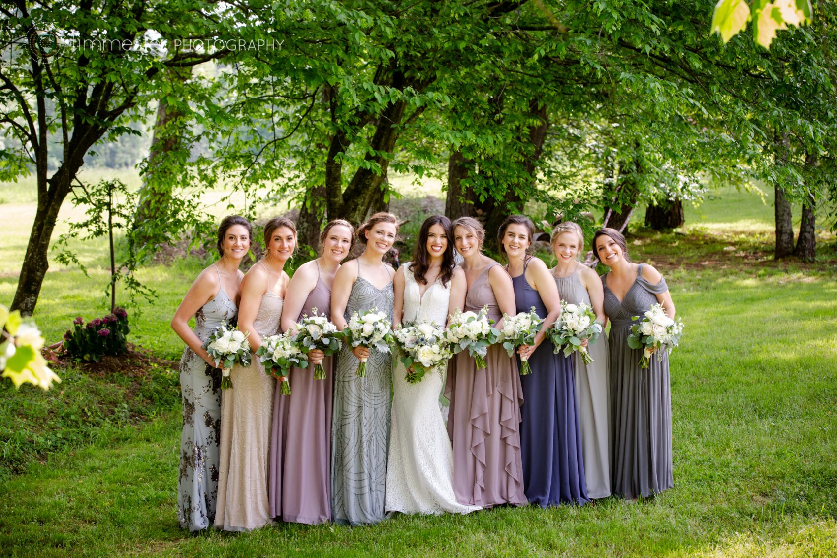 Beautiful bride, Chloe, with her bridesmaids in North Carolina at The Barn at Valhalla in Chapel Hill. 