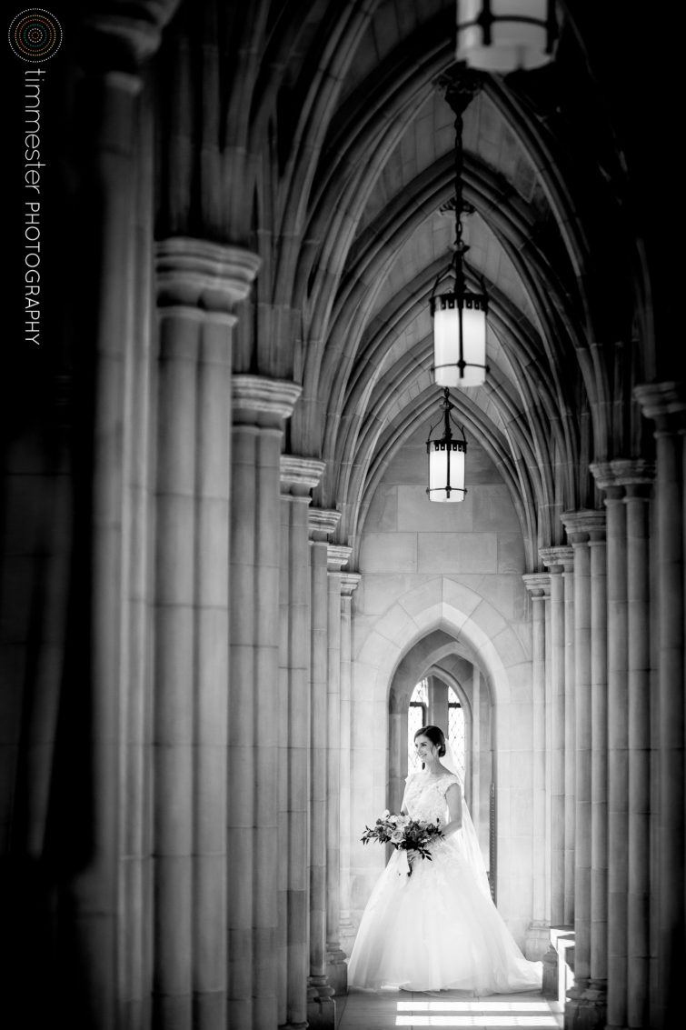 A bride poses for wedding day portraits at the National Cathedral in Washington, DC.
