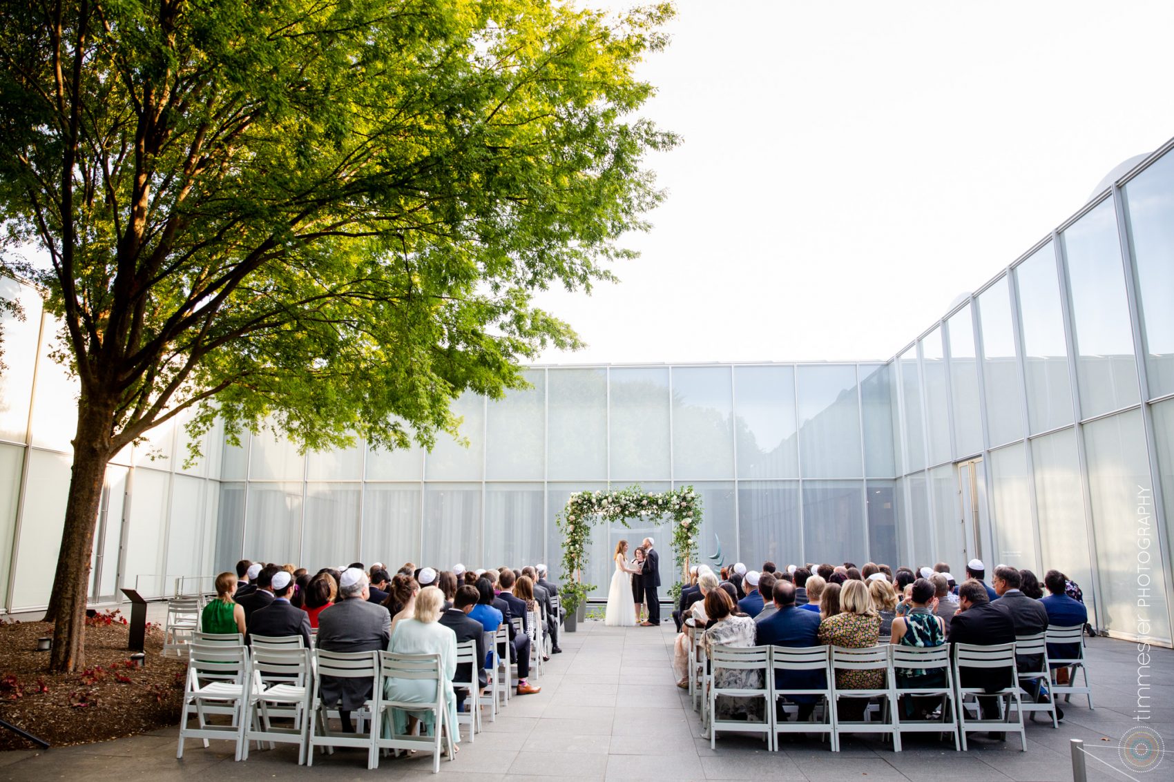 An outdoor, courtyard ceremony at NCMA in Raleigh, North Carolina.
