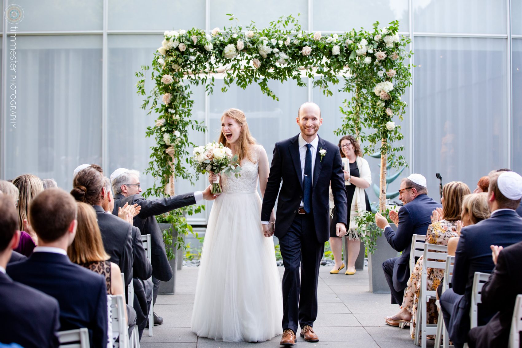 A bride and groom are married in an outdoor, courtyard wedding ceremony at NCMA in Raleigh, North Carolina.