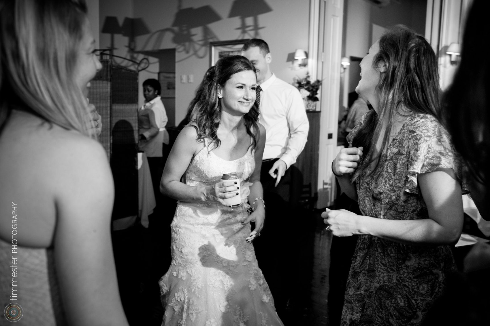 A bride on the dance floor at her wedding reception in Raleigh, NC at Caffe Luna.