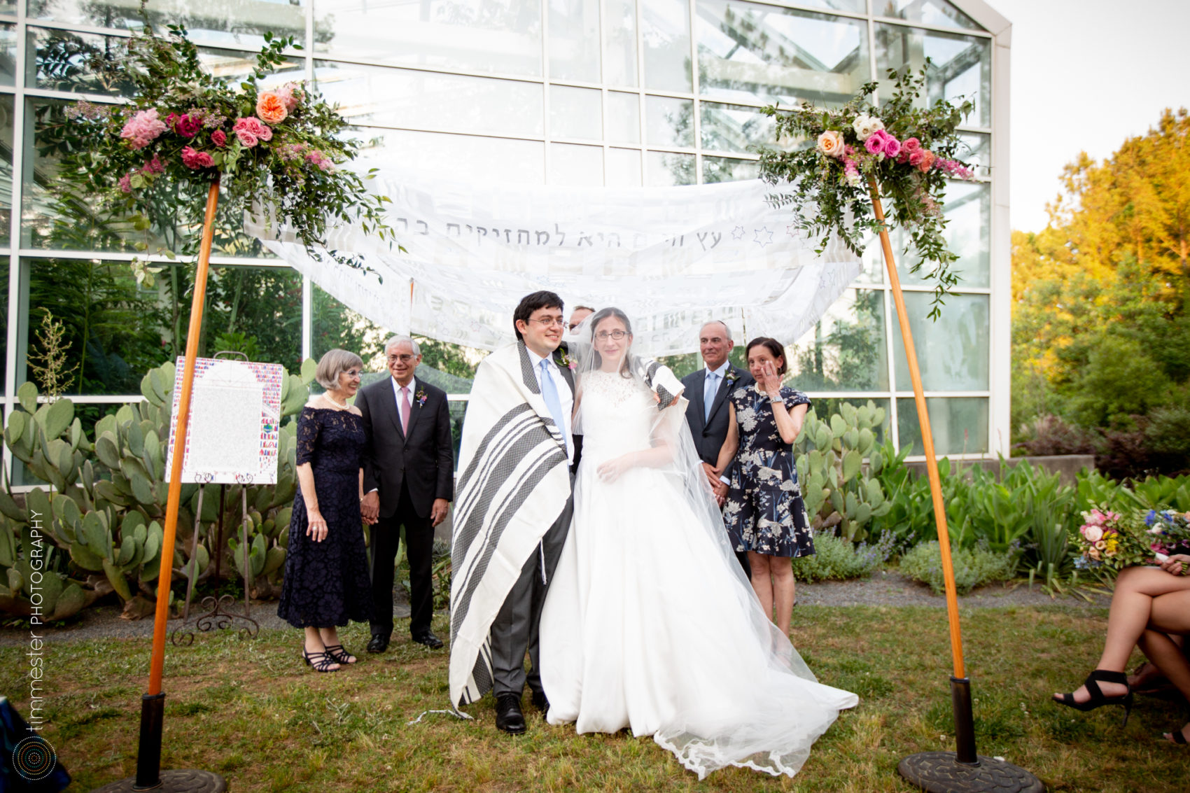 A wedding ceremony outside the Butterfly Conservatory at the Museum of Life and Science in Durham, NC