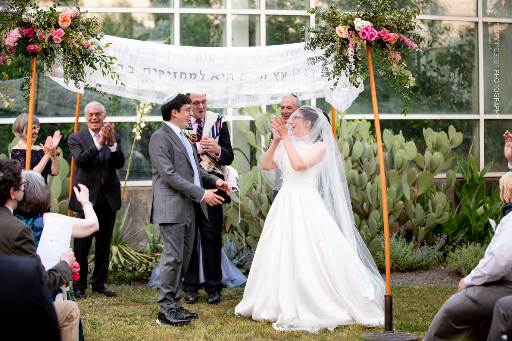 A Jewish wedding ceremony outside the butterfly conservatory at the Museum of Life and Science in Durham