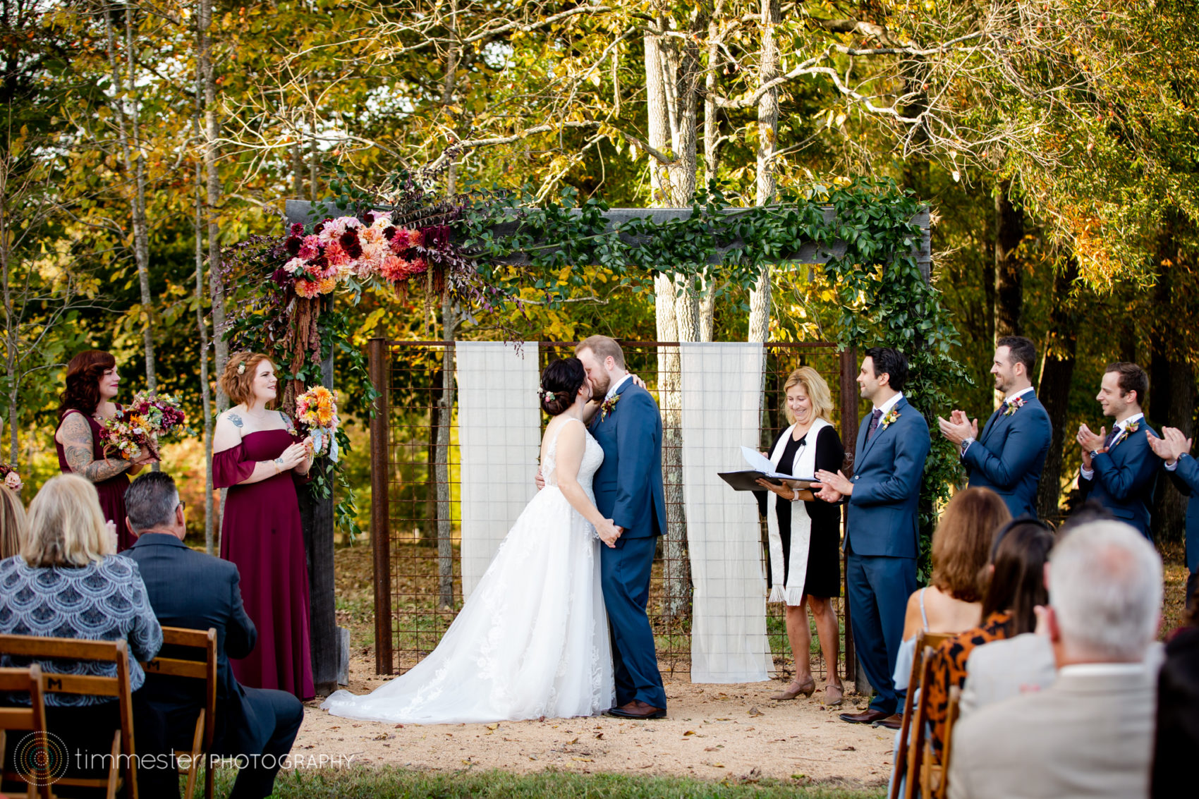 An outdoor wedding ceremony in October, the fall, at Sassafras Fork Farm in North Carolina.